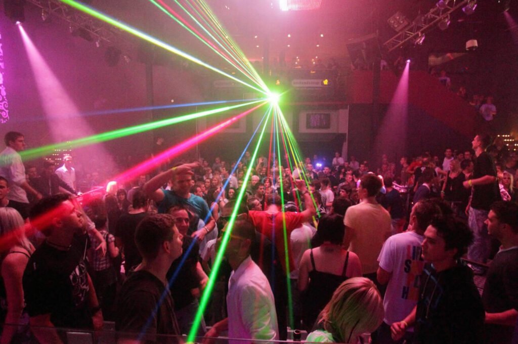 The vibrant nightclub in Dubai is attracting a lively crowd who are enjoying the vibrant nightlife scene.